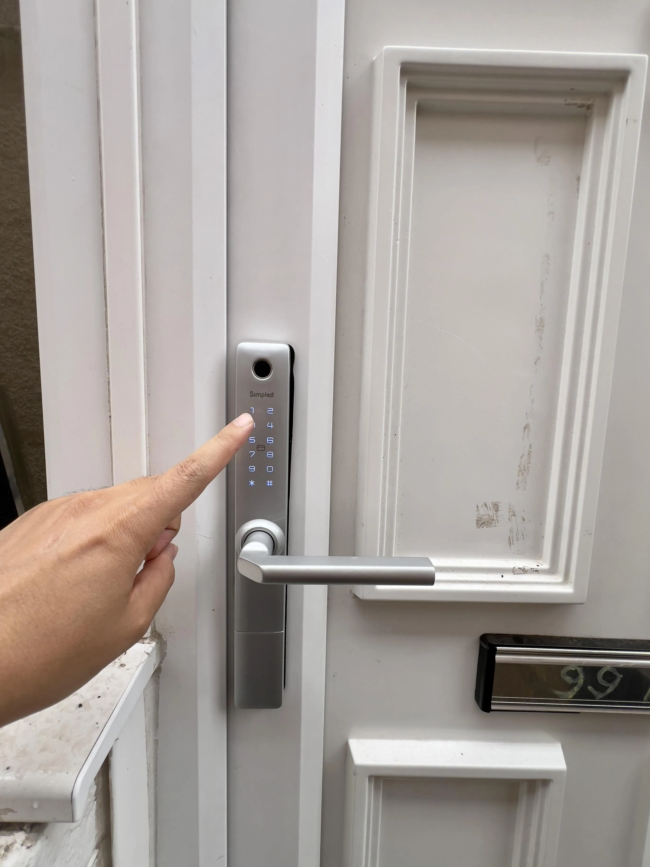 Now, enter your passcode on the smart lock's number pad and press the # button. The door will unlock.